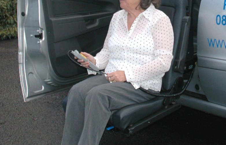 A woman sitting on a swivel seat