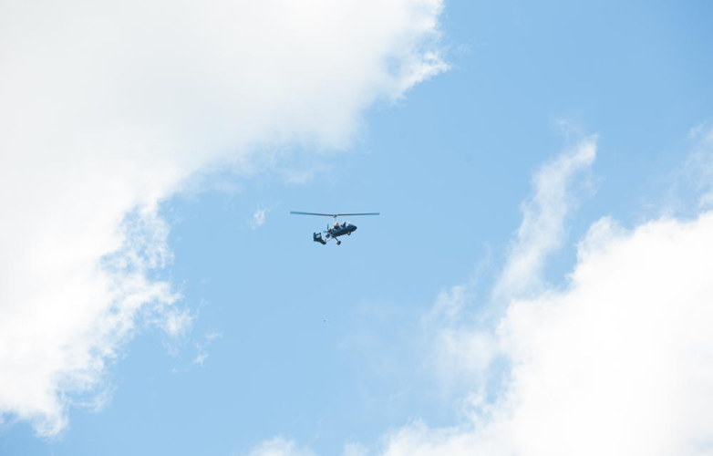 Helicopter flying in blue sky