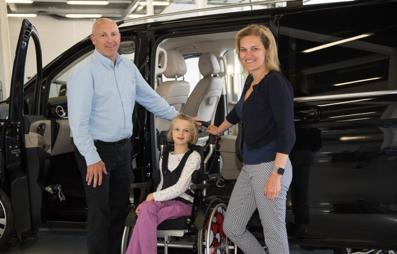 Girl in wheelchair with mum and WAV dealer