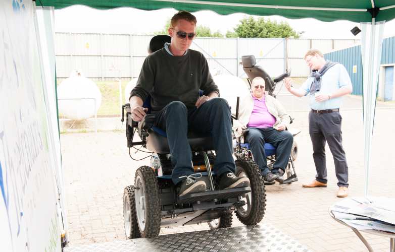 Powered wheelchair user entering a WAV