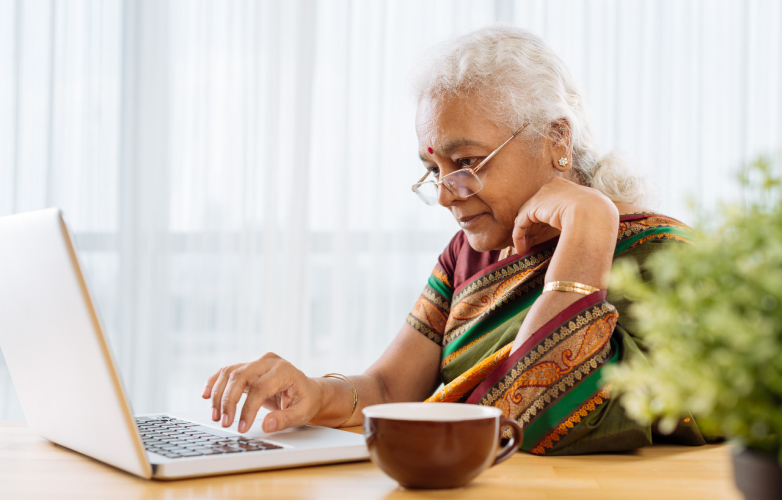 Older woman using a computer at home