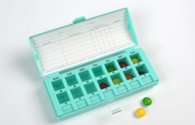 Pill box open with 2 tablets 