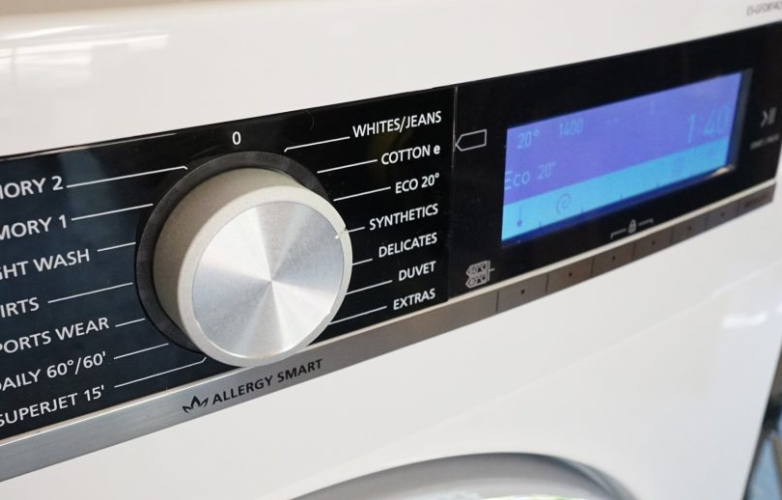 Picture of a dial and touch screen on a washing machine