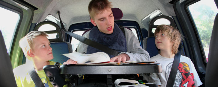 Disabled child with brother and sister in car
