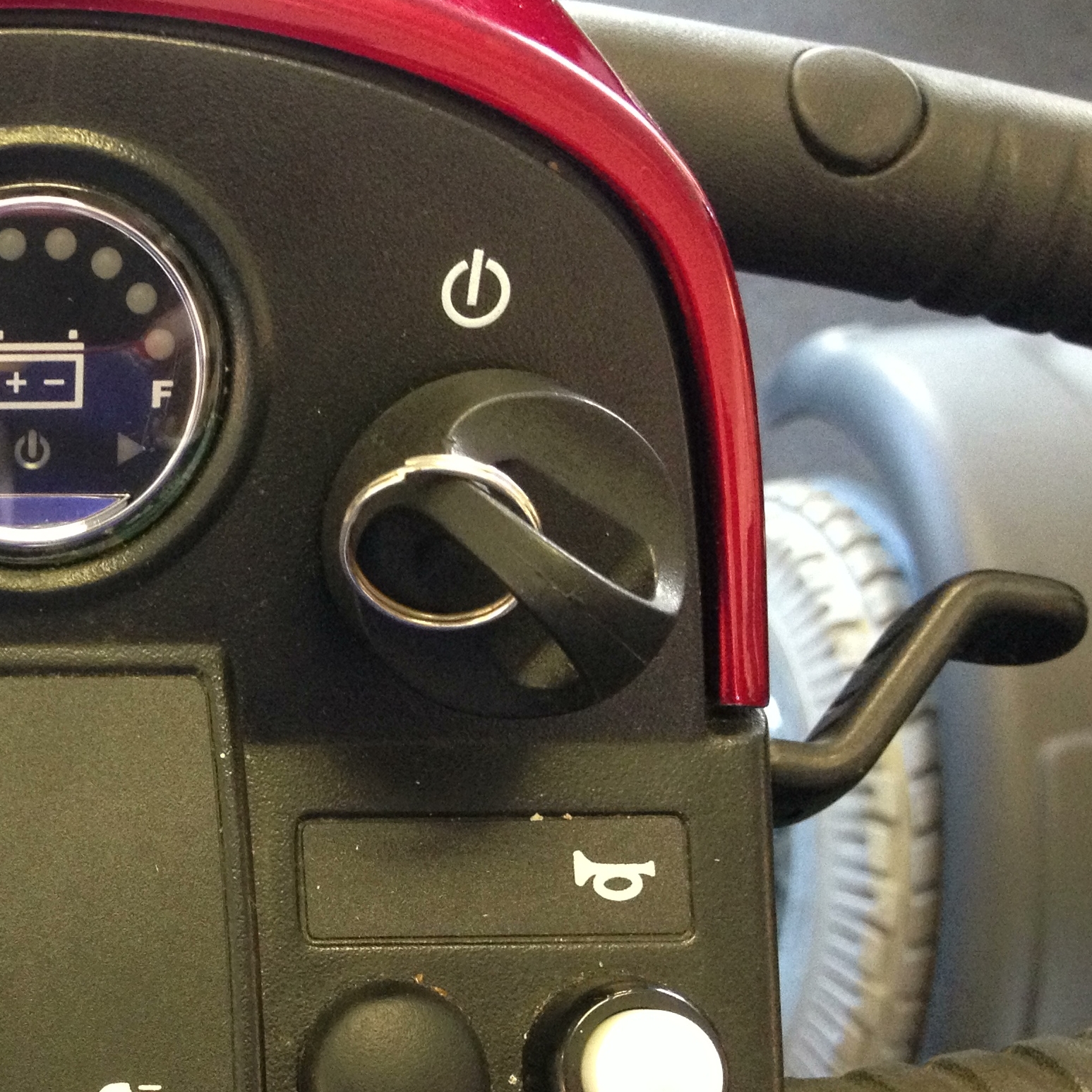 Mobility scooter with attached key