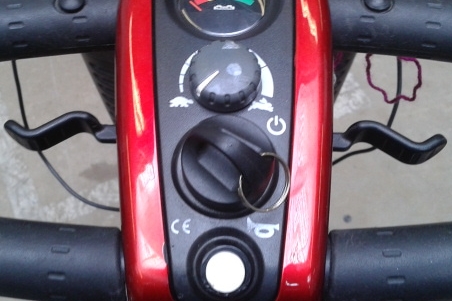 Labelled forward and reverse levers on mobility scooter
