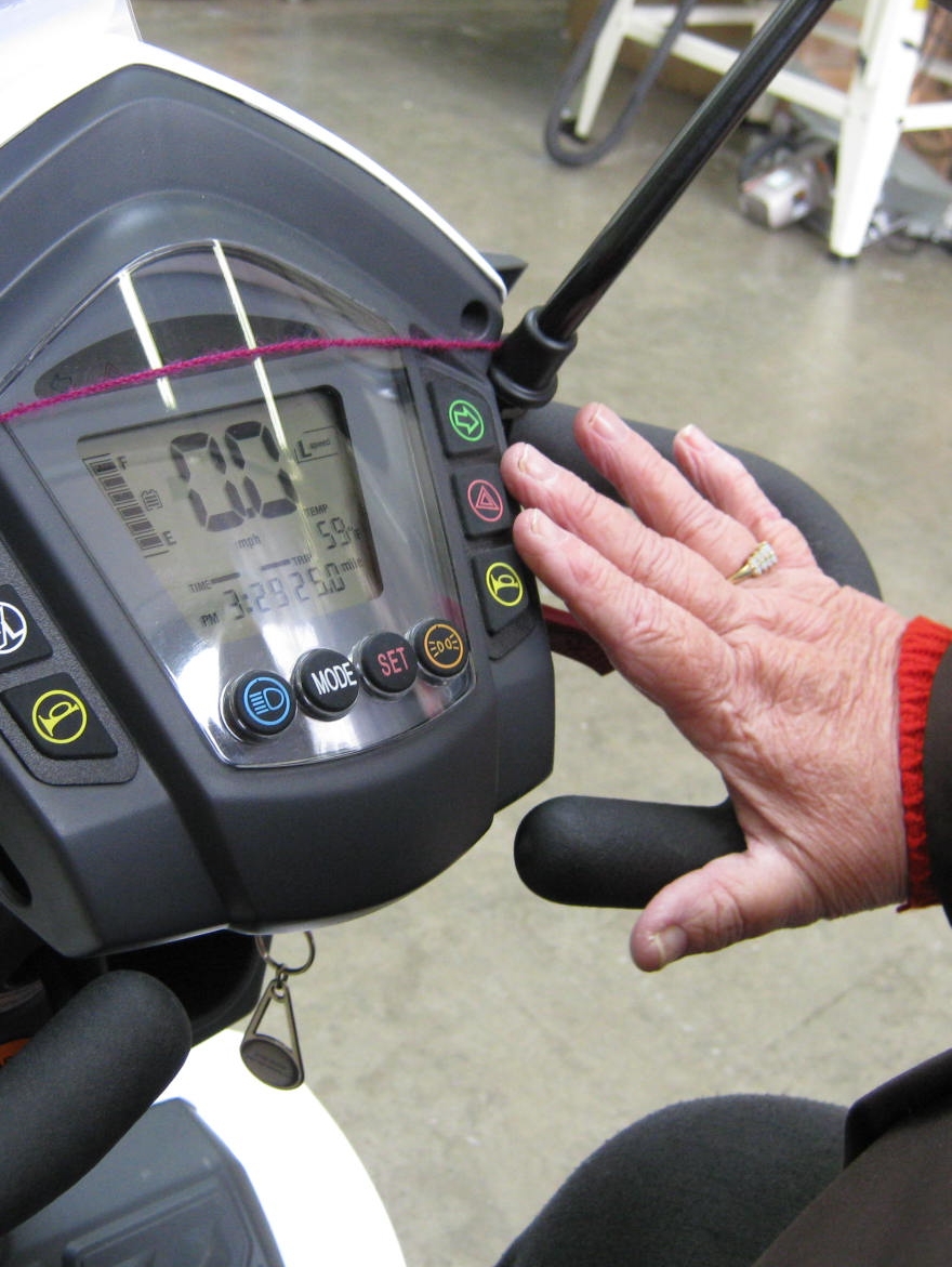 Mobility scooters reaching the controls